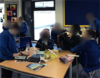 Children using ipad in class